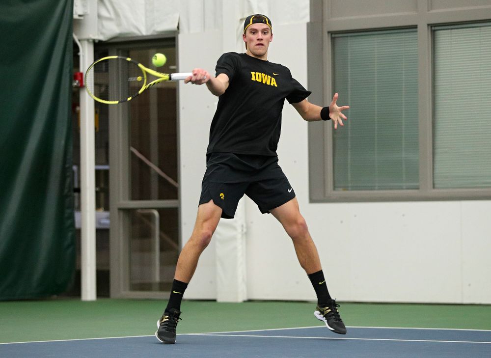 Iowa’s Joe Tyler returns a shot during his singles match at the Hawkeye Tennis and Recreation Complex in Iowa City on Friday, March 6, 2020. (Stephen Mally/hawkeyesports.com)
