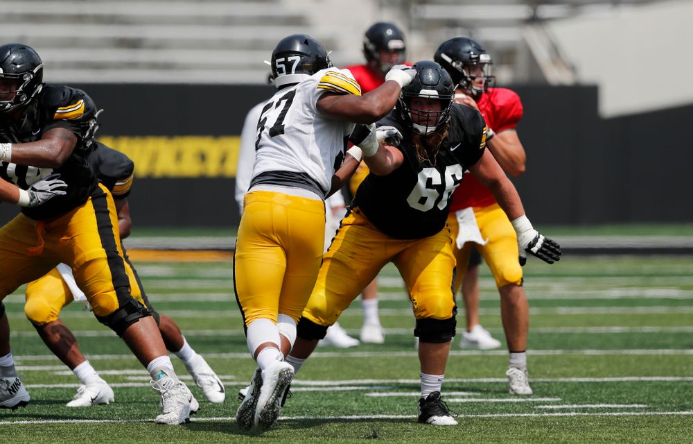 Iowa Hawkeyes offensive lineman Levi Paulsen (66) and defensive end Chauncey Golston (57) during Kids Day Saturday, August 11, 2018 at Kinnick Stadium. (Brian Ray/hawkeyesports.com)