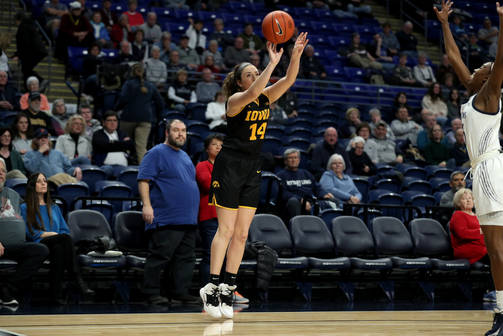 Iowa Hawkeyes forward McKenna Warnock (14) knocks down a three point basket against the Penn State Nittany Lions Thursday, January 30, 2020 at the Bryce Jordan Center. (Brian Ray/hawkeyesports.com)