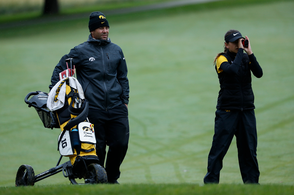 Iowa assistant coach Michael Roters gives advice as Iowa's Brett Permann checks the distance to the pin during the Diane Thomason Invitational at Finkbine Golf Course on September 29, 2018. (Tork Mason/hawkeyesports.com)