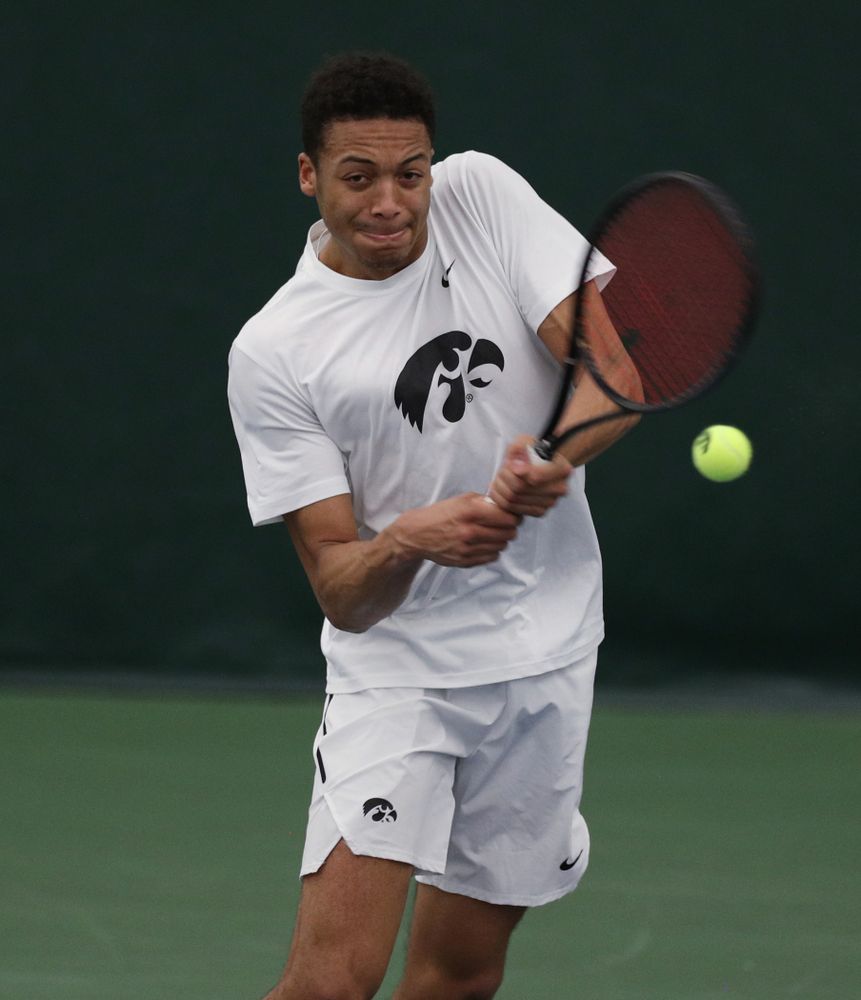 Iowa’s Oliver Okonkwo against Cornell Sunday, March 8, 2020 at the Hawkeye Tennis and Recreation Center. (Brian Ray/hawkeyesports.com)
