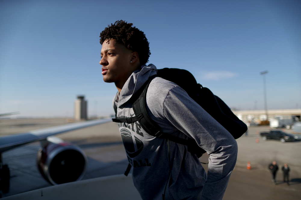 Iowa Hawkeyes defensive back Julius Brents (20) boards the team plane at the Eastern Iowa Airport Saturday, December 21, 2019 on the way to San Diego, CA for the Holiday Bowl. (Brian Ray/hawkeyesports.com)