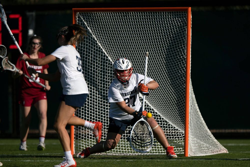 STANFORD, California - FEBRUARY 14: Virginia Cavaliers goalkeeper Charlie Campbell (27) saves a shot against the Stanford Cardinal during the first half at Cagan Stadium on February 14, 2020 in Stanford, California. The Virginia Cavaliers defeated the Stanford Cardinal 12-11. (Photo by Jason O. Watson)