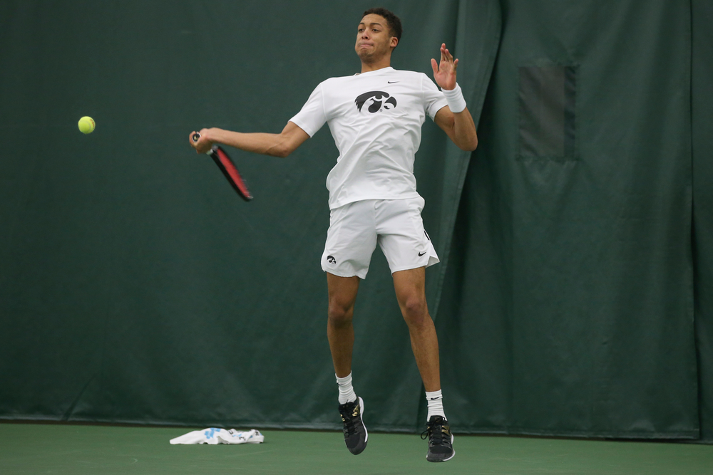 Iowa’s Oliver Okonkwo returns a hit during the Iowa men’s tennis meet vs Nebraska on Sunday, March 1, 2020 at the Hawkeye Tennis and Recreation Complex. (Lily Smith/hawkeyesports.com)