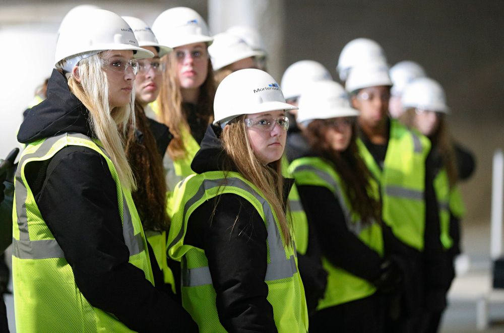 Iowa’s Kyndra Hansen (from left) and Joslyn Boyer look on as the Iowa Volleyball team and staff take a construction tour of Xtream Arena in Coralville on Thursday, January 30, 2020. (Stephen Mally/hawkeyesports.com)