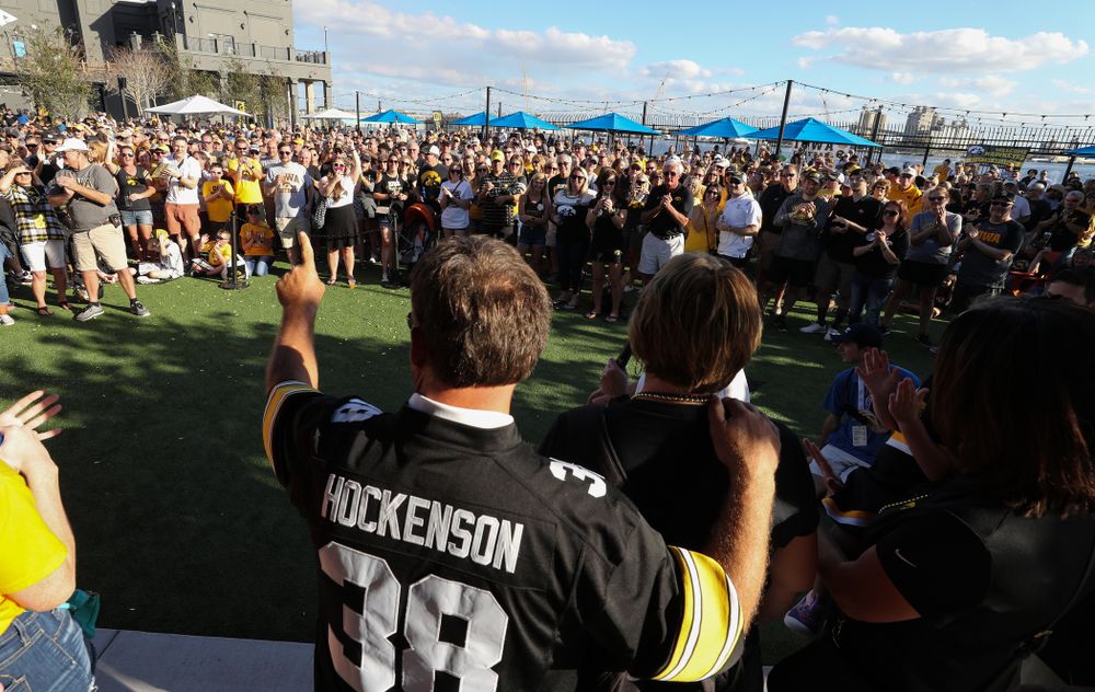 Fans chant "One More Year" as the Voice of the Hawkeyes Gary Dolphin introduces the family of Iowa Hawkeyes tight end T.J. Hockenson (38) during the Hawkeye Huddle Monday, December 31, 2018 at Sparkman Wharf in Tampa, FL. (Brian Ray/hawkeyesports.com)
