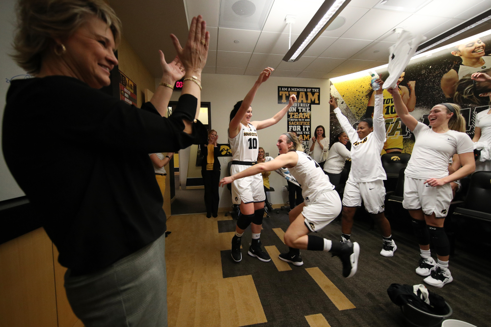 Iowa Hawkeyes forward Megan Gustafson (10) and forward Hannah Stewart (21) celebrate their victory over the Rutgers Scarlet Knights Wednesday, January 23, 2019 at Carver-Hawkeye Arena. (Brian Ray/hawkeyesports.com)