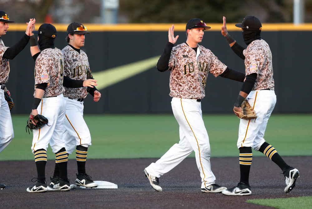 Iowa Hawkeyes outfielder Robert Neustrom (44) and third baseman Lorenzo Elion (1) against the Ohio State Buckeyes Saturday, April 7, 2018 at Duane Banks Field. (Brian Ray/hawkeyesports.com)