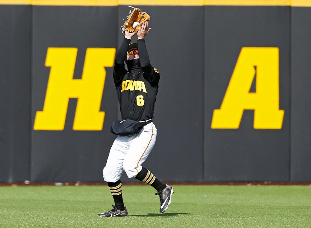 Iowa Hawkeyes center fielder Justin Jenkins (6) pulls in a fly ball for an out during the eighth inning of their game against Illinois at Duane Banks Field in Iowa City on Saturday, Mar. 30, 2019. (Stephen Mally/hawkeyesports.com)