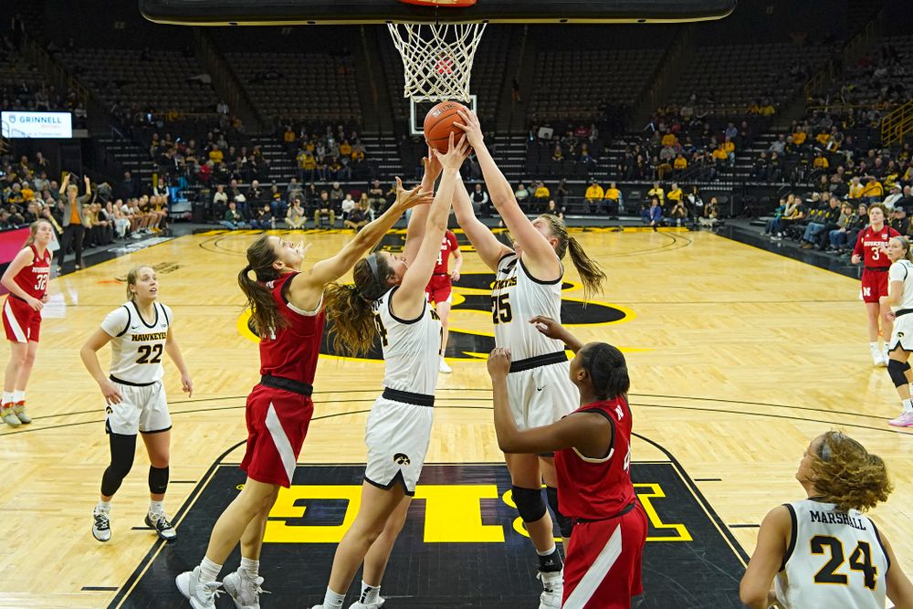 Iowa Hawkeyes guard McKenna Warnock (14) battles for a rebound with forward Monika Czinano (25) during the fourth quarter of the game at Carver-Hawkeye Arena in Iowa City on Thursday, February 6, 2020. (Stephen Mally/hawkeyesports.com)