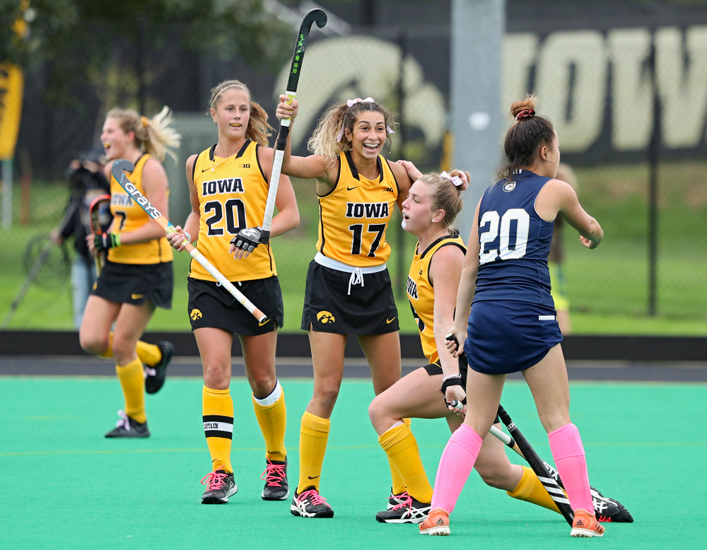 Iowa’s Sophie Sunderland (20) and Ciara Smith (17) celebrate with Nikki Freeman (8) after Freeman’s goal during the third quarter of their game against UC Davis at Grant Field in Iowa City on Sunday, Oct 6, 2019. (Stephen Mally/hawkeyesports.com)