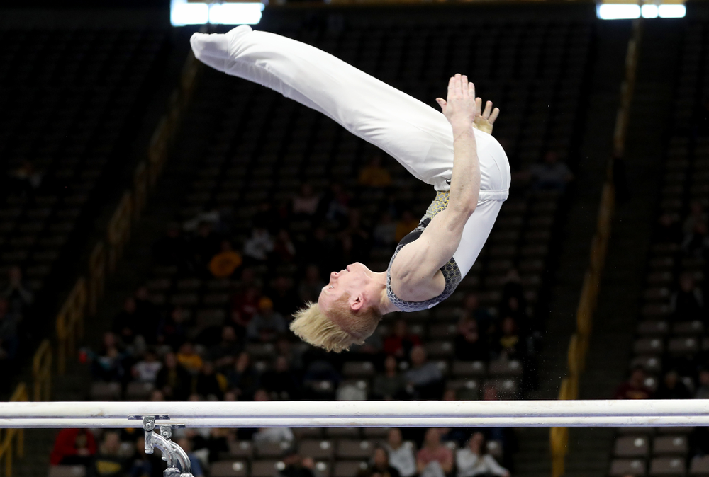 Iowa’s Nick Merryman competes on the parallel bars against UIC and Minnesota Saturday, February 1, 2020 at Carver-Hawkeye Arena. (Brian Ray/hawkeyesports.com)