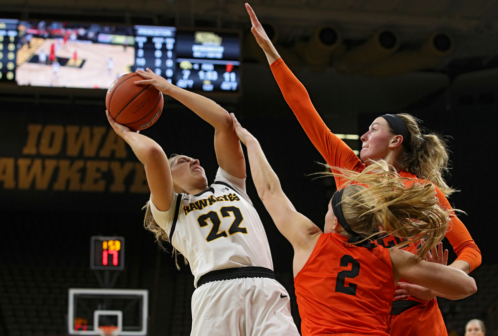 Iowa guard Kathleen Doyle (22) is fouled as she shoots during the first quarter of their overtime win against Princeton at Carver-Hawkeye Arena in Iowa City on Wednesday, Nov 20, 2019. (Stephen Mally/hawkeyesports.com)