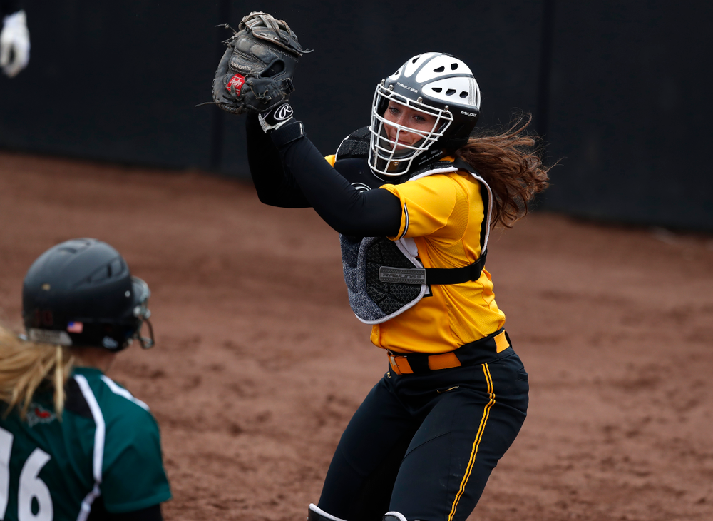 Iowa Hawkeyes catcher Angela Schmiederer (12) against UW Green Bay Tuesday, March 27, 2018 at Bob Pearl Field. (Brian Ray/hawkeyesports.com)