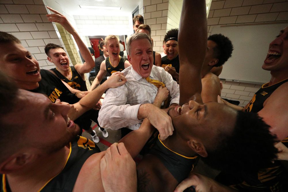 Iowa Hawkeyes assistant coach Kirk Speraw dances with the players as they celebrate their win against the Iowa State Cyclones Thursday, December 12, 2019 at Hilton Coliseum in Ames, Iowa(Brian Ray/hawkeyesports.com)