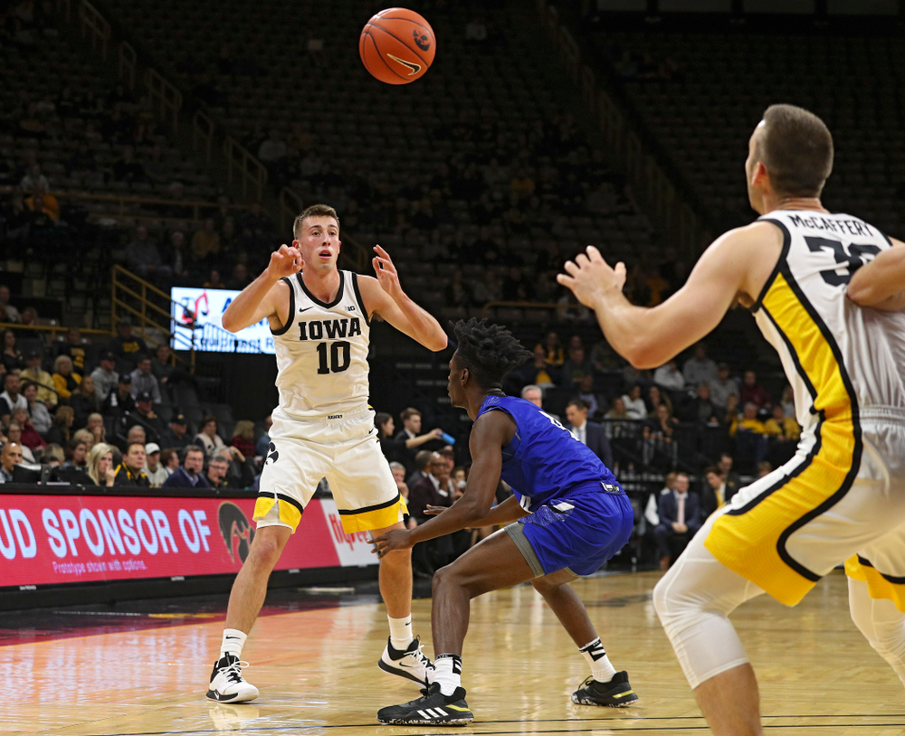 Iowa Hawkeyes guard Joe Wieskamp (10) passes the ball to guard Connor McCaffery (30) during the first half of their exhibition game against Lindsey Wilson College at Carver-Hawkeye Arena in Iowa City on Monday, Nov 4, 2019. (Stephen Mally/hawkeyesports.com)