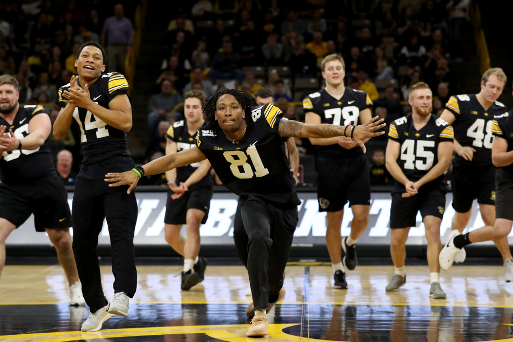 Members of the Hawkeye Football team performs with the Iowa Dance Team at halftime of the Iowa Hawkeyes game against the Ohio State Buckeyes Thursday, February 20, 2020 at Carver-Hawkeye Arena. (Brian Ray/hawkeyesports.com)