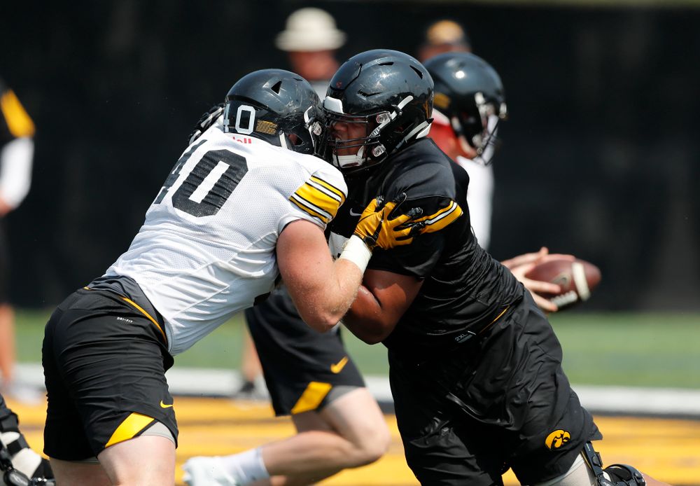 Iowa Hawkeyes offensive lineman Alaric Jackson (77) and defensive end Parker Hesse (40) during fall camp practice No. 9 Friday, August 10, 2018 at the Kenyon Practice Facility. (Brian Ray/hawkeyesports.com)