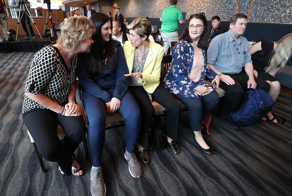 Iowa Hawkeyes forward Megan Gustafson (10) sits with head coach Lisa Bluder and associate head coach Jan Jensen during an awards new conference Thursday, April 4, 2019 at Amalie Arena in Tampa, FL. (Brian Ray/hawkeyesports.com)