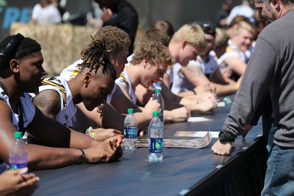 Members of the Iowa Football team sign autographs before the Iowa Hawkeyes game against the Nebraska Cornhuskers Saturday, April 20, 2019 at Duane Banks Field. (Brian Ray/hawkeyesports.com)