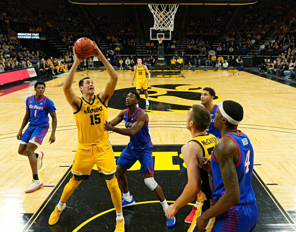 Iowa Hawkeyes forward Ryan Kriener (15) scores a basket inside during the first half of their game at Carver-Hawkeye Arena in Iowa City on Monday, Nov 11, 2019. (Stephen Mally/hawkeyesports.com)