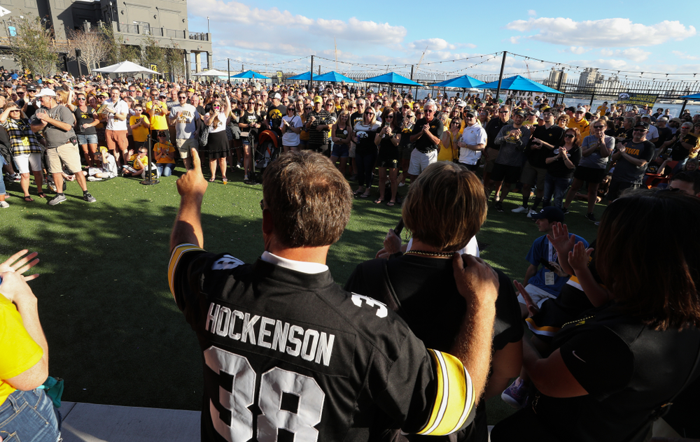 Fans chant "One More Year" as the Voice of the Hawkeyes Gary Dolphin introduces the family of Iowa Hawkeyes tight end T.J. Hockenson (38) during the Hawkeye Huddle Monday, December 31, 2018 at Sparkman Wharf in Tampa, FL. (Brian Ray/hawkeyesports.com)