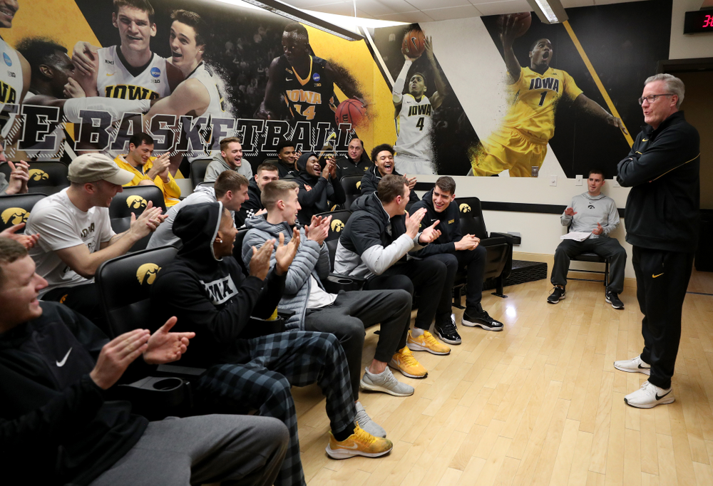 The Iowa Hawkeyes congratulate forward Luka Garza (55) after finding out that he has been named the Big Ten Player of the Year Monday, March 9, 2020 at Carver-Hawkeye Arena. (Brian Ray/hawkeyesports.com)