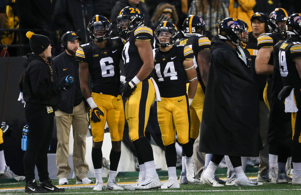 Iowa Hawkeyes wide receiver Ihmir Smith-Marsette (6) watches the video board as officials review his catch, which was originally ruled incomplete, during a game against Northwestern at Kinnick Stadium on November 10, 2018. (Tork Mason/hawkeyesports.com)