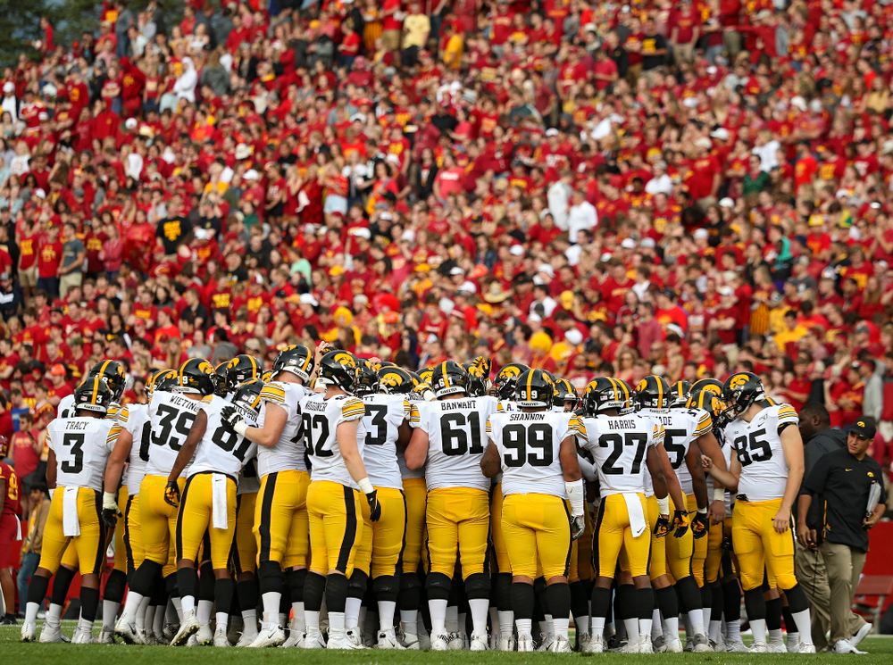 The Iowa Hawkeyes huddle after warming up following a weather delay during the first quarter of their Iowa Corn Cy-Hawk Series game at Jack Trice Stadium in Ames on Saturday, Sep 14, 2019. (Stephen Mally/hawkeyesports.com)