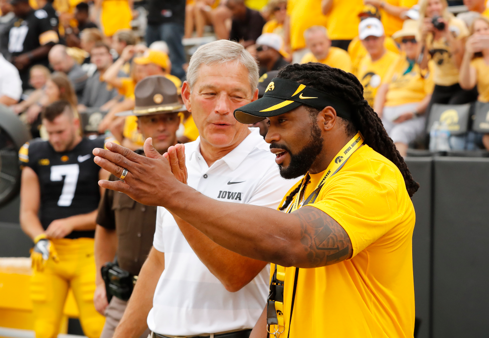 Iowa Hawkeyes head coach Kirk Ferentz talks with former Hawkeyes Bob Sanders against the Norther Illinois Huskies Saturday, September 1, 2018 . (Brian Ray/hawkeyesports.com)