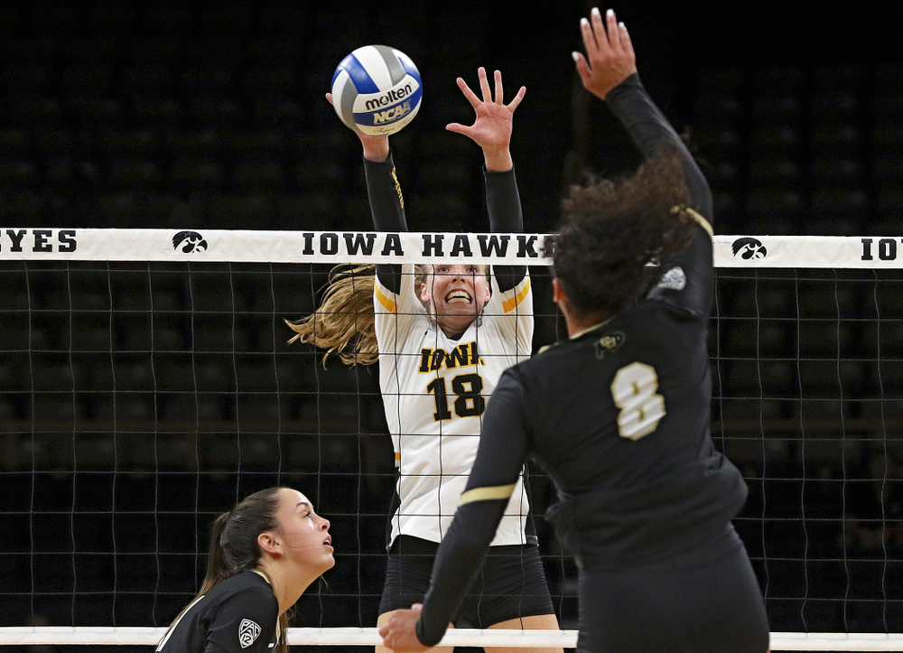 Iowa’s Hannah Clayton (18) gets her hands on a shot during the third set of their Big Ten/Pac-12 Challenge match against Colorado at Carver-Hawkeye Arena in Iowa City on Friday, Sep 6, 2019. (Stephen Mally/hawkeyesports.com)