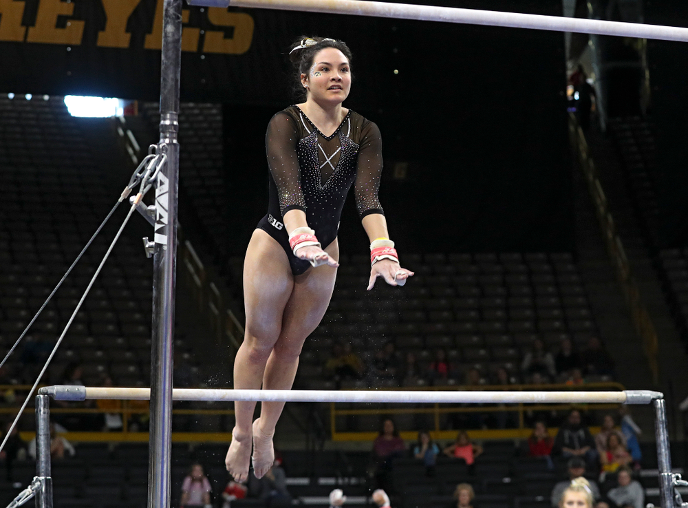Iowa’s Carina Tolan competes on the bars during their meet at Carver-Hawkeye Arena in Iowa City on Sunday, March 8, 2020. (Stephen Mally/hawkeyesports.com)